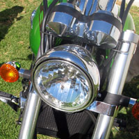 The Kawasaki versions has a conventional headlight.